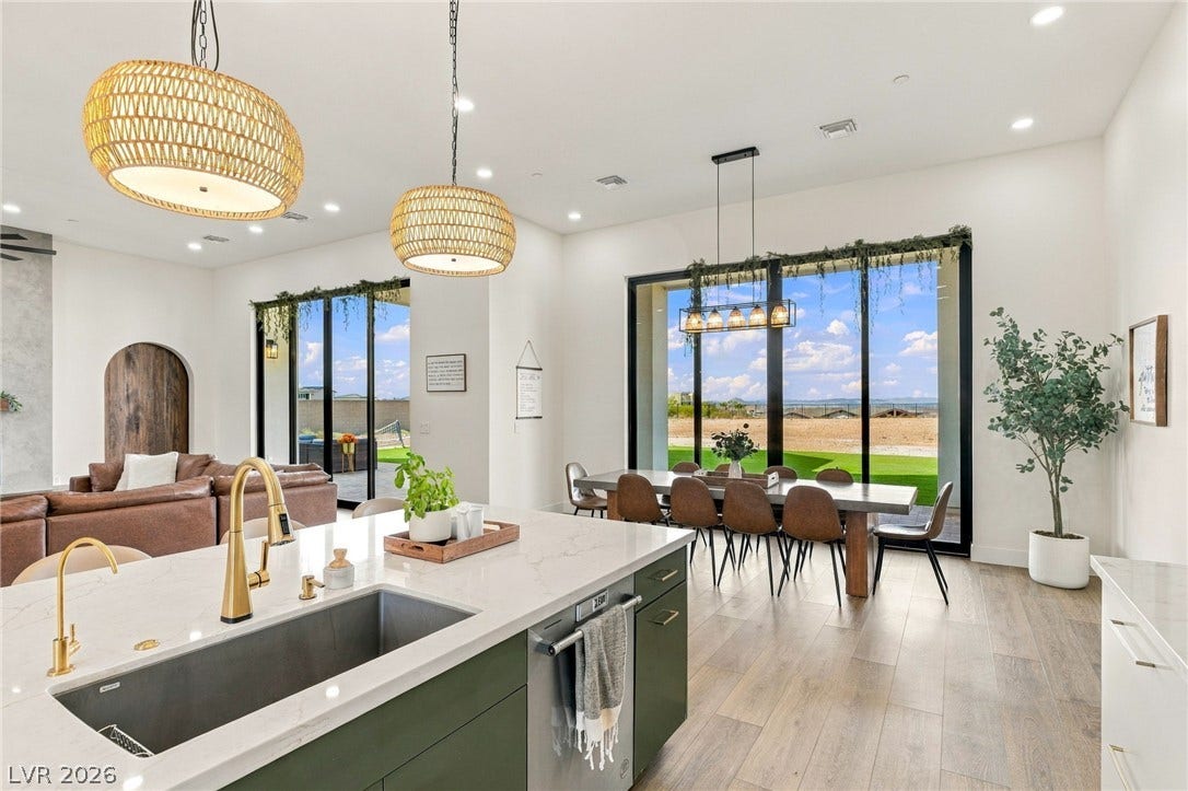 324 Wanda Road, Henderson, NV 89002 Gleaming wood floors anchor this expansive open layout illuminated by recessed lights and glass doors.