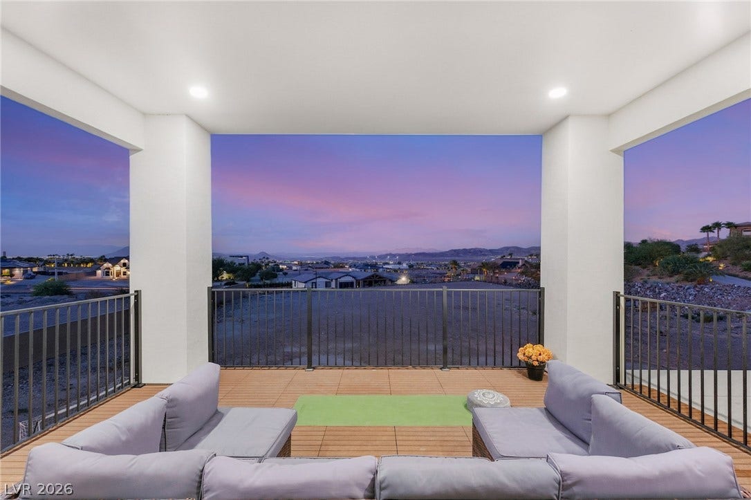 324 Wanda Road, Henderson, NV 89002 An elevated covered balcony showcases wood plank flooring and expansive horizon views.