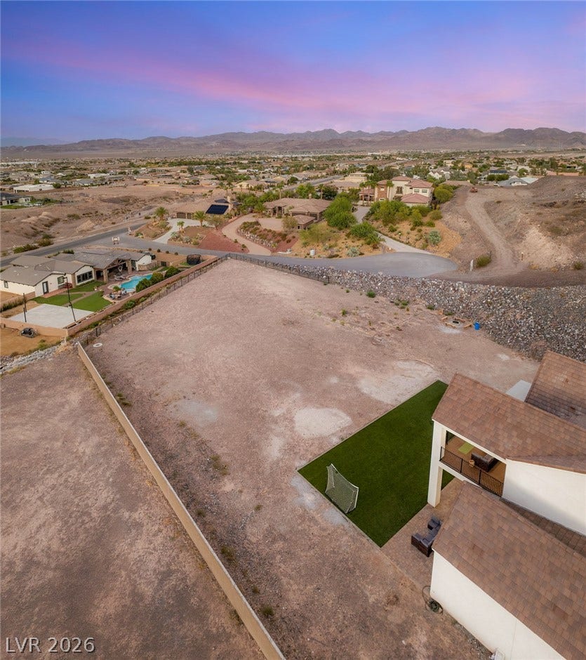 324 Wanda Road, Henderson, NV 89002 An expansive graded lot provides endless customization possibilities against a scenic mountain backdrop.