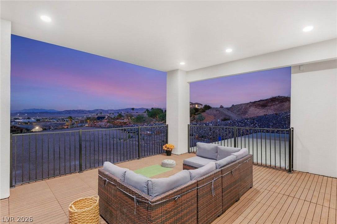 324 Wanda Road, Henderson, NV 89002 An elevated covered balcony showcases sweeping mountain views and recessed overhead lighting.