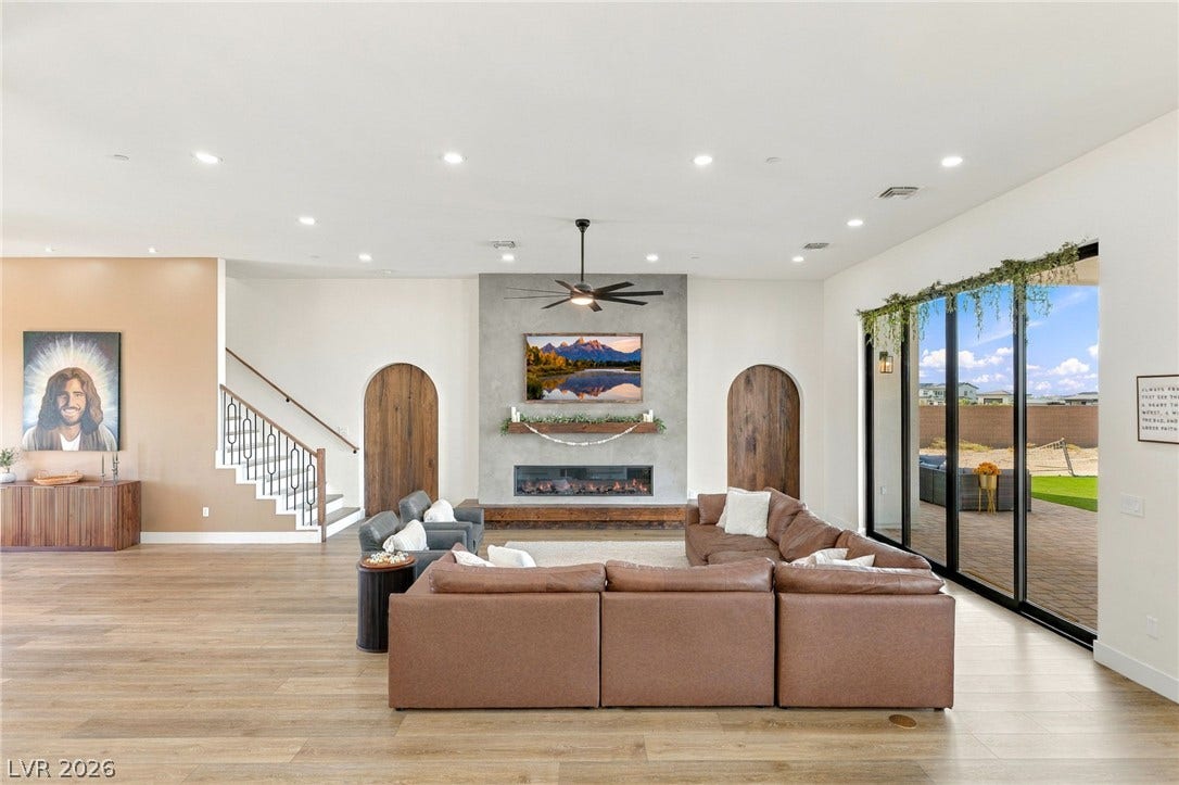 324 Wanda Road, Henderson, NV 89002 Recessed lighting and wide-plank flooring define this airy living space featuring a modern fireplace.