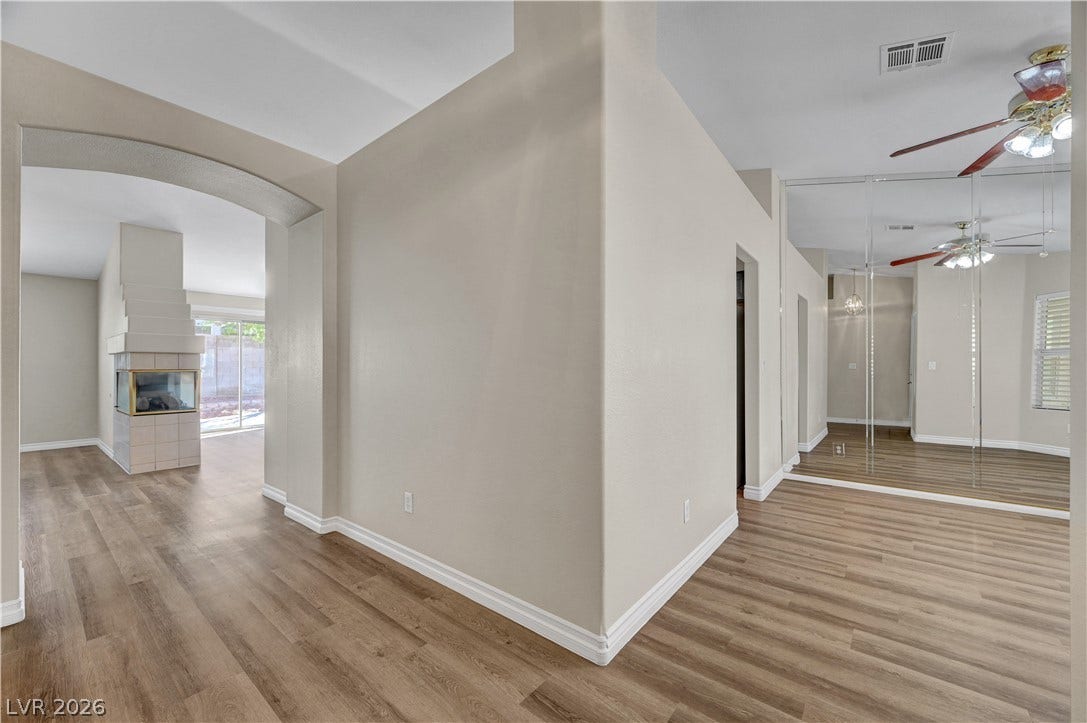 Clean architectural lines and durable flooring guide you through this versatile open floorplan.