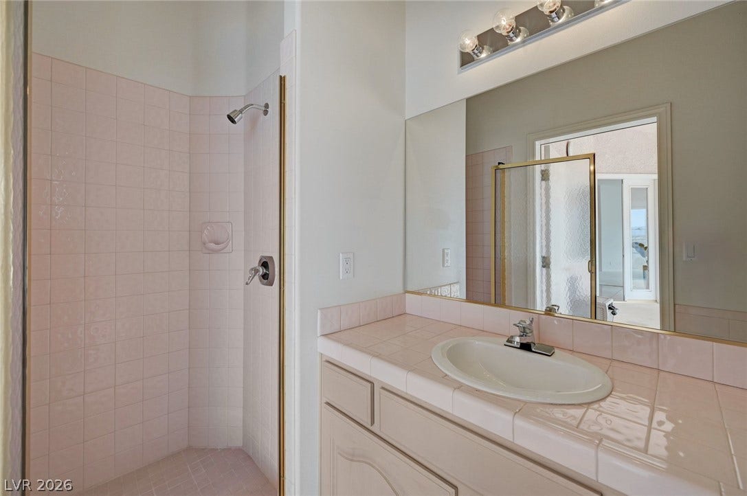 1112 Boletus Drive, Henderson, NV 89011 A classic tiled vanity pairs perfectly with the walk-in shower.
