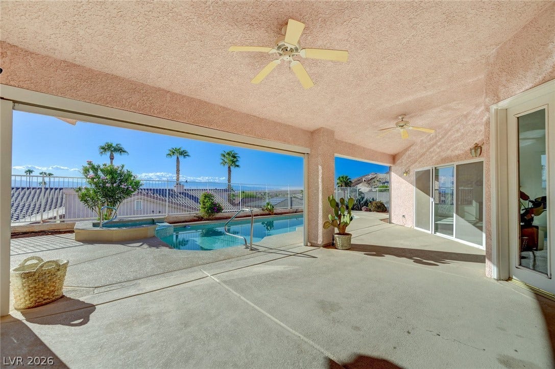 1112 Boletus Drive, Henderson, NV 89011 An expansive covered concrete patio looks out onto a sparkling private swimming pool and spa.
