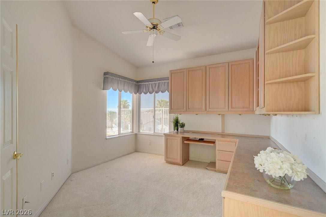 1112 Boletus Drive, Henderson, NV 89011 Ample built-in cabinetry and a wrap-around desk highlight this functional workspace.
