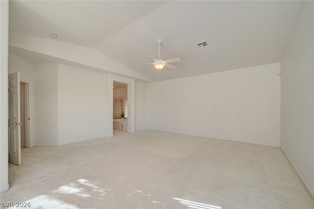 1112 Boletus Drive, Henderson, NV 89011 High vaulted ceilings and soft carpeted floors define this airy bedroom suite.