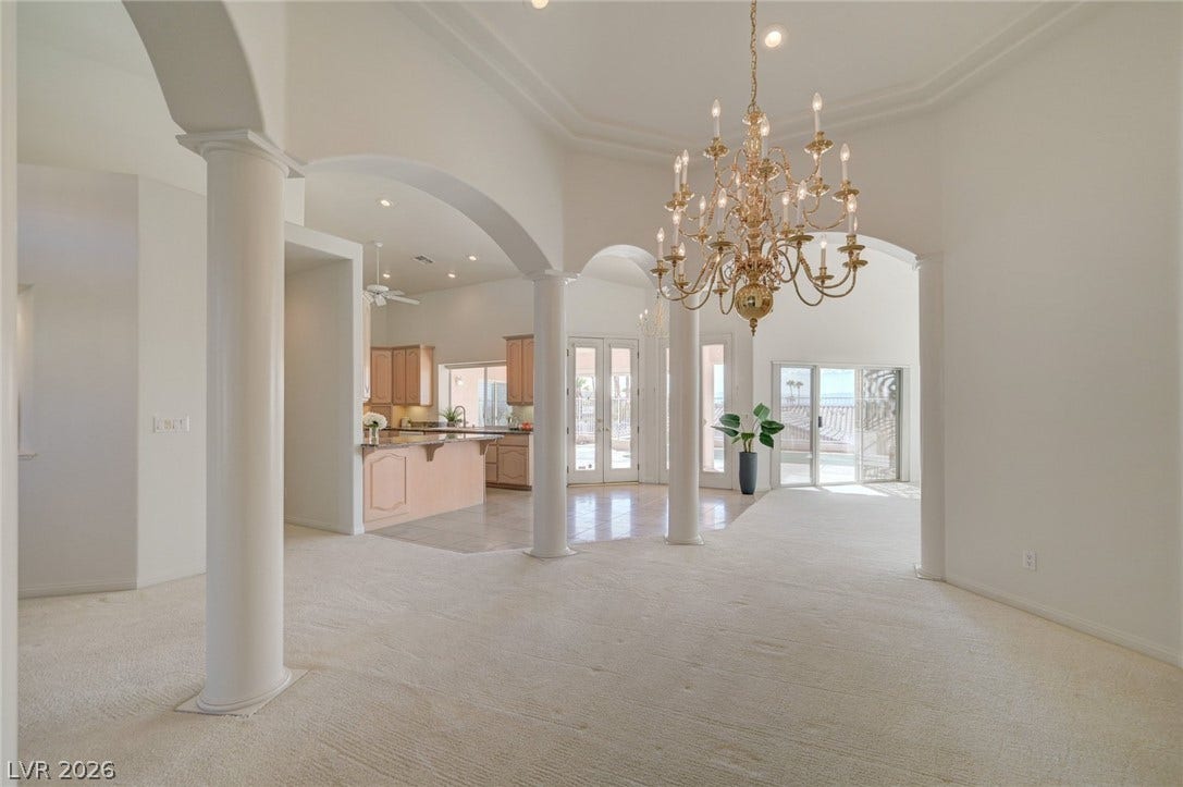 1112 Boletus Drive, Henderson, NV 89011 Elegant columns and soaring arched transitions frame a spacious open floor plan.