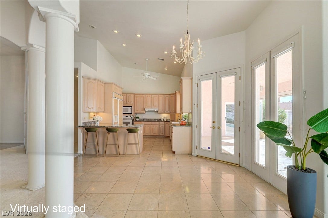 1112 Boletus Drive, Henderson, NV 89011 Grand columns and soaring ceilings framing French doors welcome you into this light-filled home.