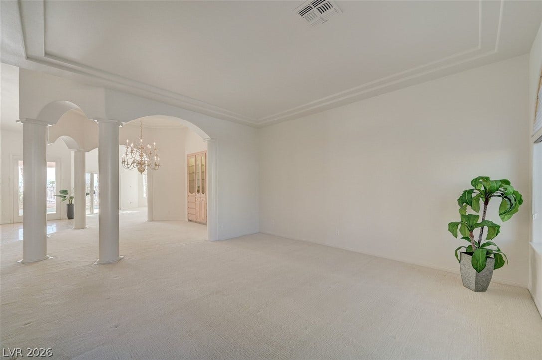 1112 Boletus Drive, Henderson, NV 89011 Classical columns and elegant arched openings frame this light-filled formal living space.