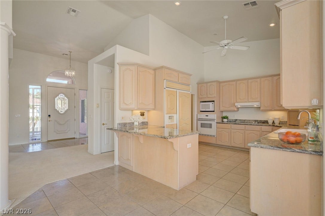 1112 Boletus Drive, Henderson, NV 89011 High ceilings and hard-surface flooring elevate this open-concept culinary space.