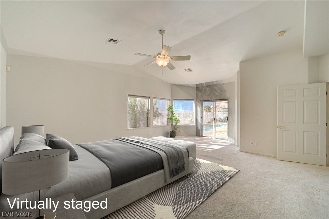 1112 Boletus Drive, Henderson, NV 89011 Vaulted ceilings and plush carpeting anchor this spacious retreat with direct outdoor access.