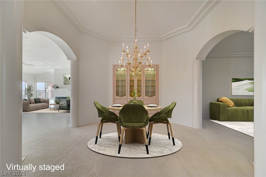 1112 Boletus Drive, Henderson, NV 89011 Elegant arched entries frame a formal dining space enhanced by refined crown molding and carpeting.