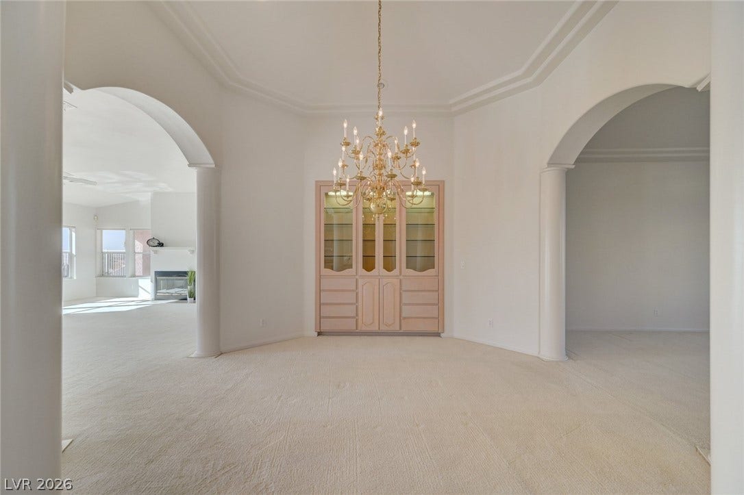 1112 Boletus Drive, Henderson, NV 89011 Arched doorways and a built-in hutch define this formal dining space with classic columns.