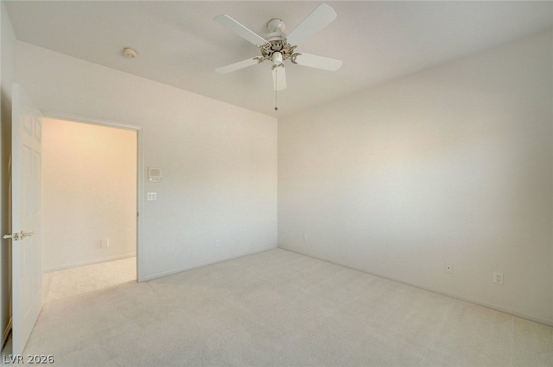 1112 Boletus Drive, Henderson, NV 89011 Soft carpeting pairs with neutral walls in this versatile secondary bedroom.