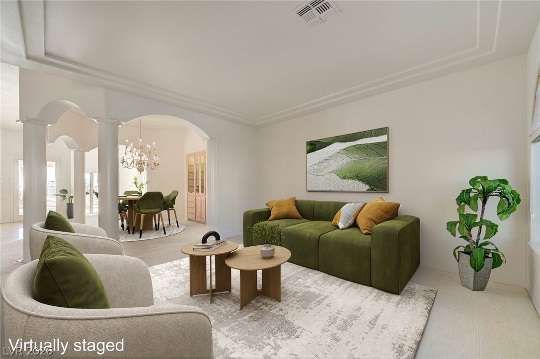 1112 Boletus Drive, Henderson, NV 89011 Classical architectural arches and crown molding frame this elegant, open-concept living space.