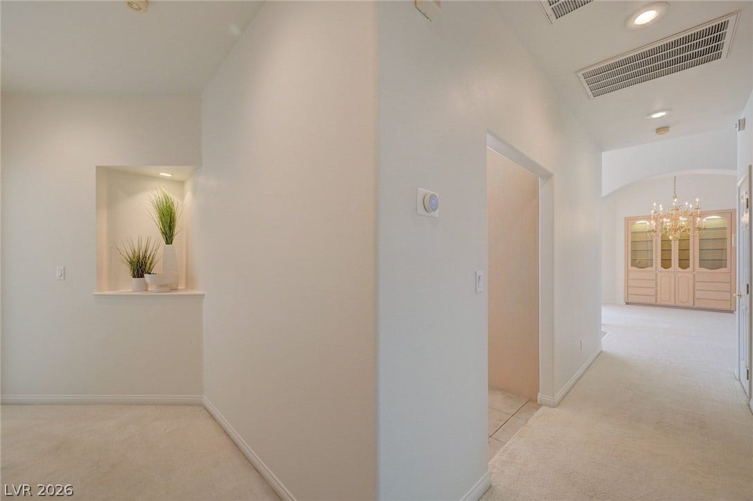 1112 Boletus Drive, Henderson, NV 89011 An inviting foyer opens to a carpeted hallway accented by recessed lighting and built-in niches.
