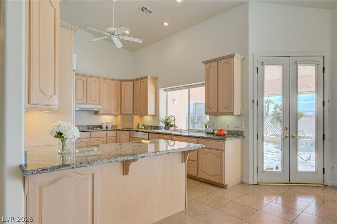 1112 Boletus Drive, Henderson, NV 89011 High ceilings and ample granite counter space define this bright, open kitchen.