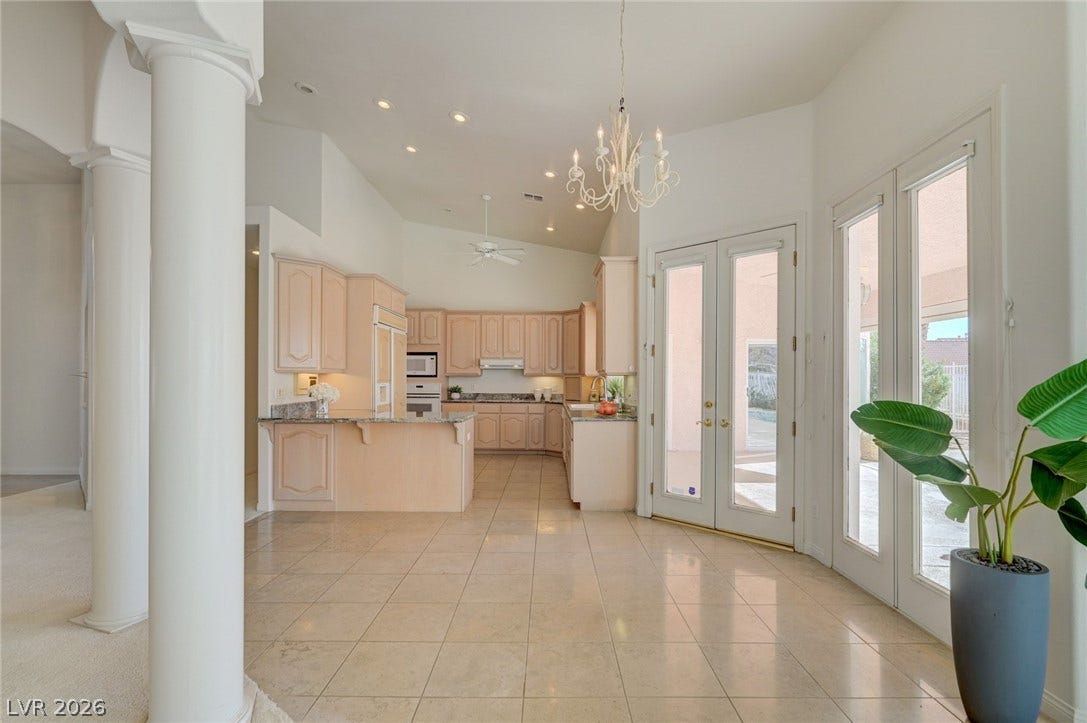 1112 Boletus Drive, Henderson, NV 89011 Gleaming tile floors and soaring ceilings create an open, airy ambience flowing into the kitchen.