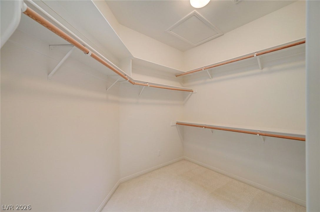 1112 Boletus Drive, Henderson, NV 89011 Ample built-in shelving and hanging rods maximize storage in this spacious walk-in closet.