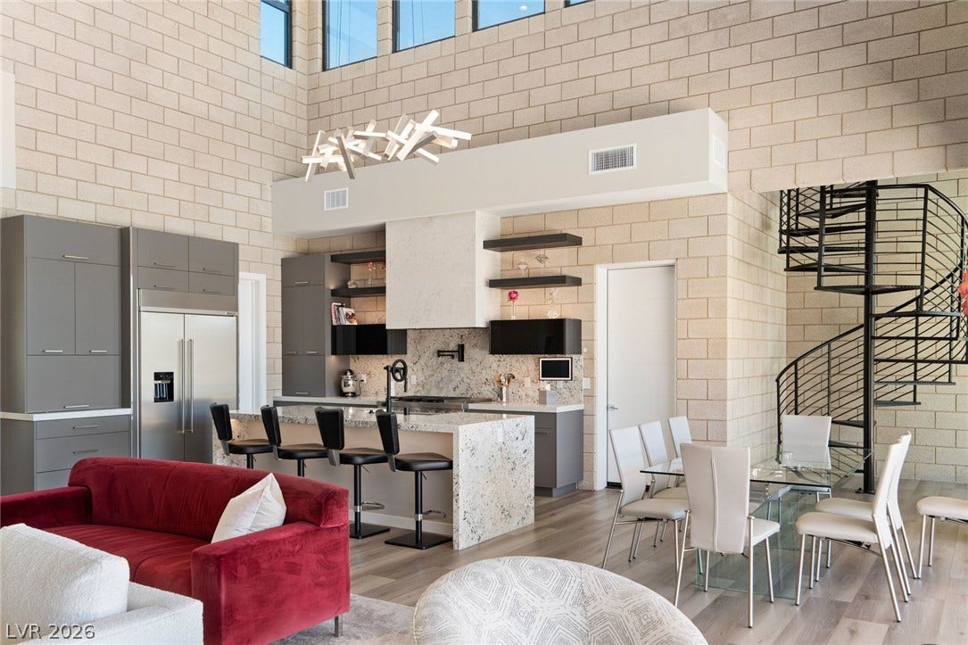 37 Reflection Shores Lane, Henderson, NV 89011 Towering ceilings and exposed block walls define this modern open-concept space.