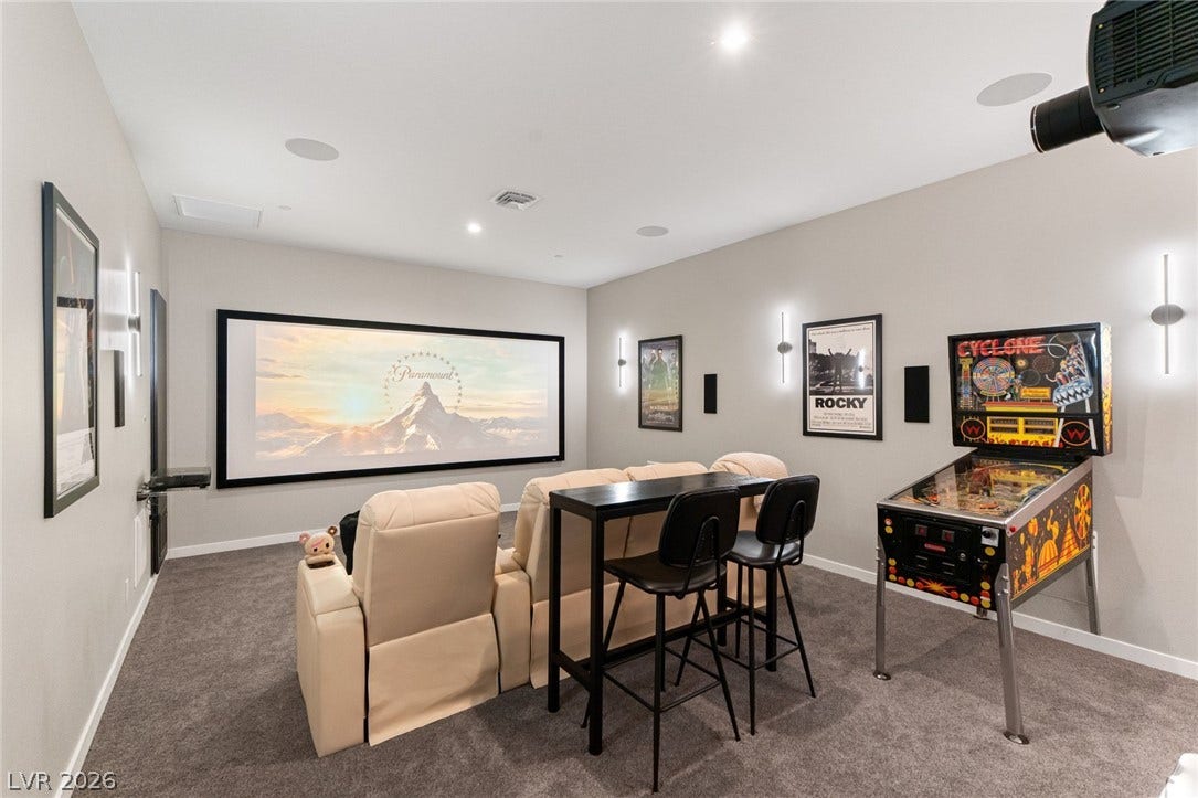 37 Reflection Shores Lane, Henderson, NV 89011 Plush carpeting anchors this dedicated home theater space designed for ultimate entertainment experiences.