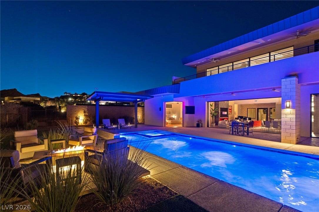 37 Reflection Shores Lane, Henderson, NV 89011 A sparkling swimming pool and integrated spa sit adjacent to the spacious back patio.