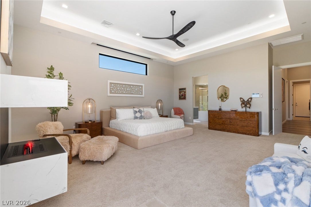 37 Reflection Shores Lane, Henderson, NV 89011 High tray ceilings and soft carpeting create a serene and restful master suite layout.