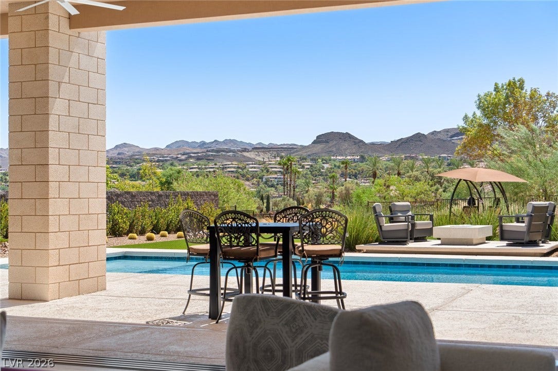 37 Reflection Shores Lane, Henderson, NV 89011 Dramatic mountain vistas frame the glistening pool and stone terrace of this outdoor oasis.