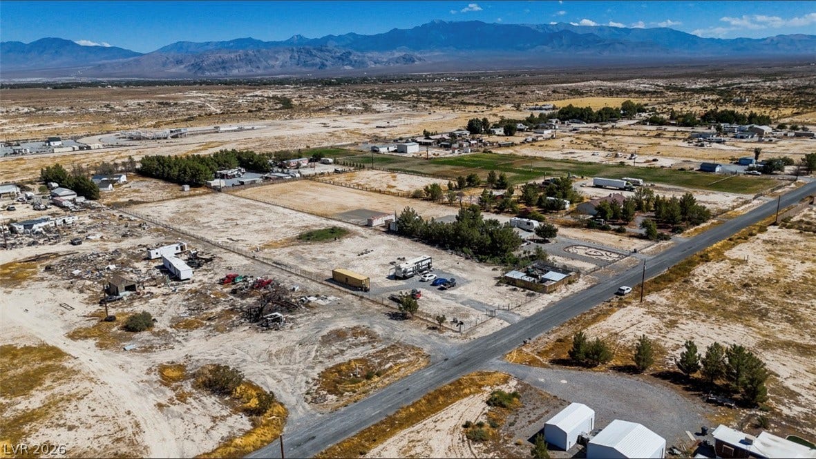 3160 Wall Street, Pahrump, NV 89061 Dramatic mountain ranges frame this vast desert lot offering incredible potential and open views.