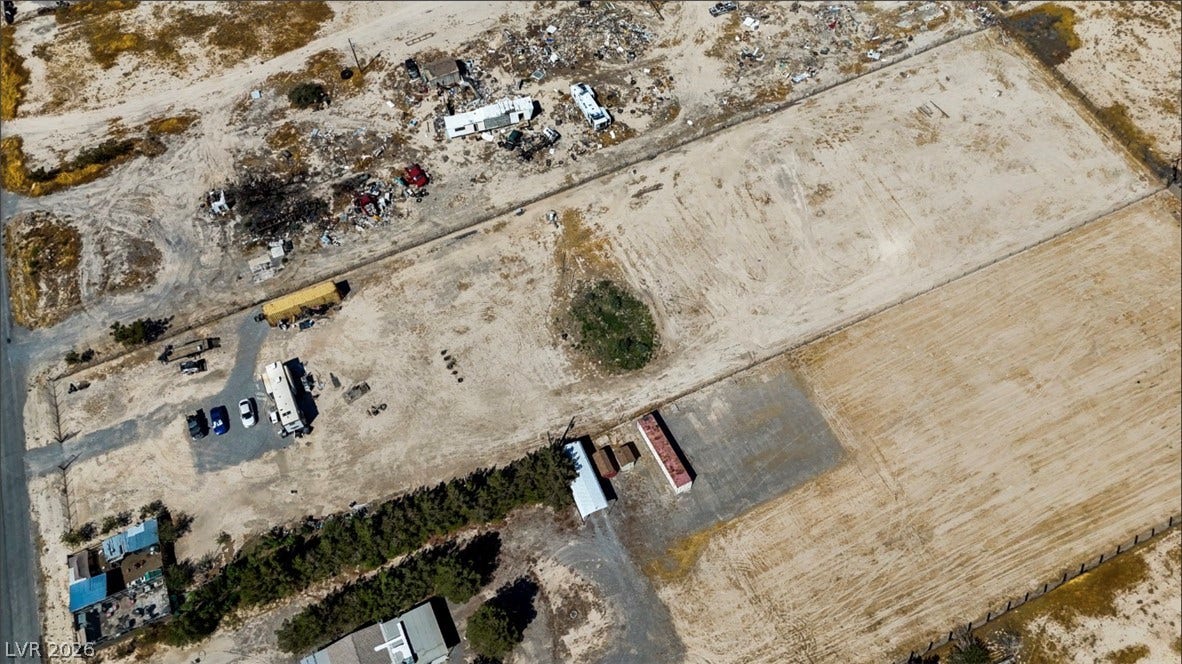 3160 Wall Street, Pahrump, NV 89061 An aerial perspective showcases the level desert parcels and surrounding open terrain.