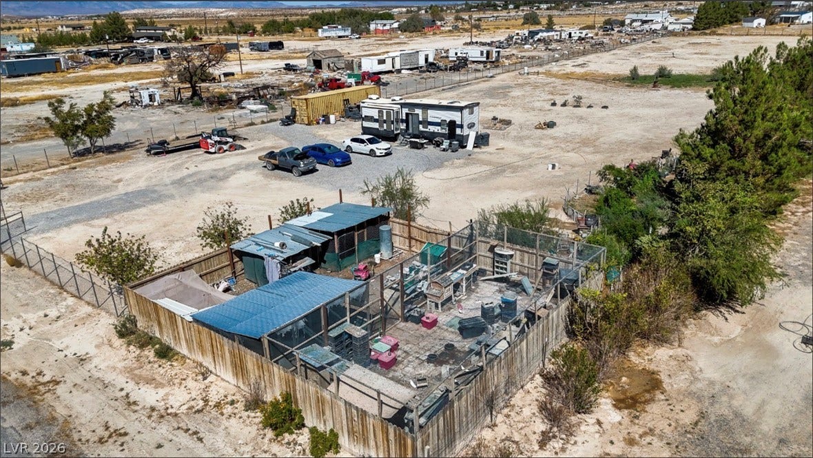 3160 Wall Street, Pahrump, NV 89061 A spacious desert parcel offers fenced enclosures and extensive open space.