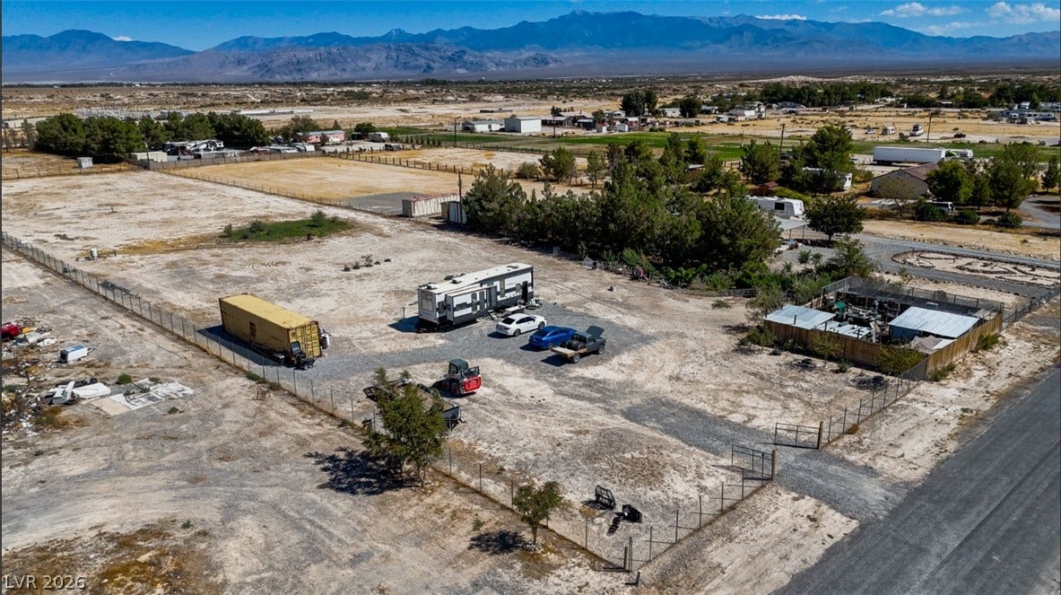 3160 Wall Street, Pahrump, NV 89061 Expansive desert acreage enjoys majestic mountain views and secured perimeter fencing.