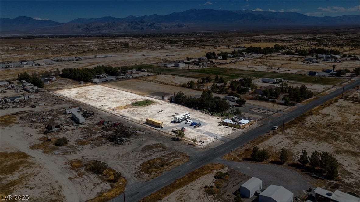 3160 Wall Street, Pahrump, NV 89061 An expansive valley plot framed by distant mountain ranges.