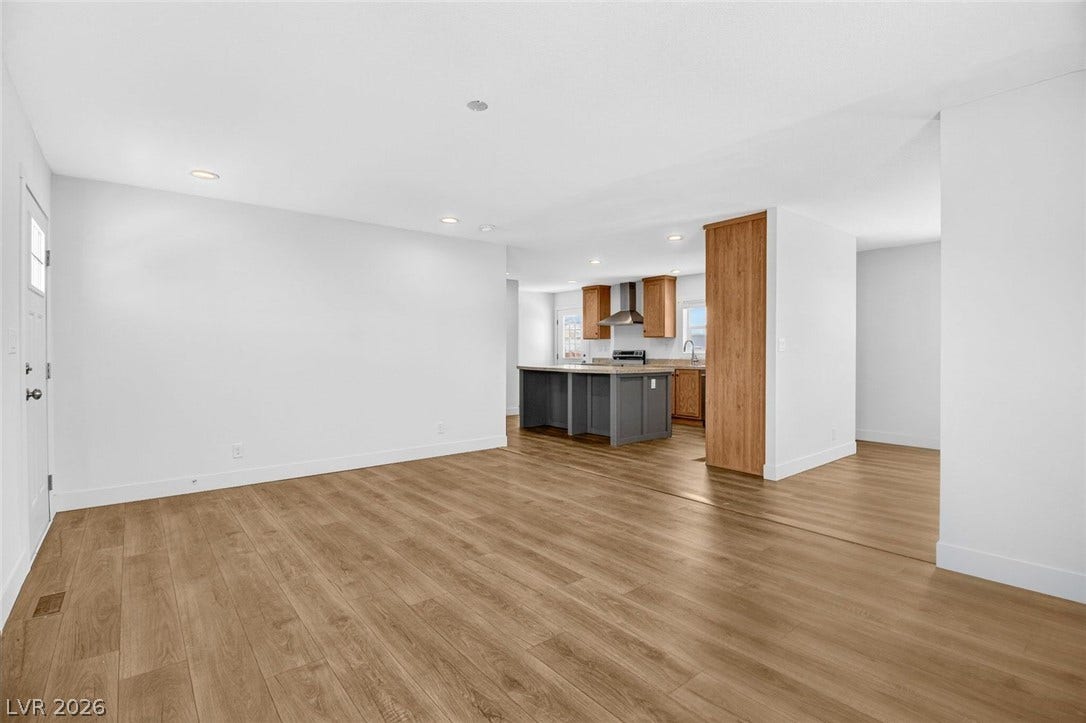 2258 Toiyabe Street, Las Vegas, NV 89156 An open floorplan seamlessly connects the versatile living area to a modern kitchen.