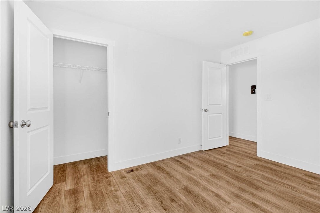 2258 Toiyabe Street, Las Vegas, NV 89156 Rich wood-look flooring and crisp trim define this versatile auxiliary space.