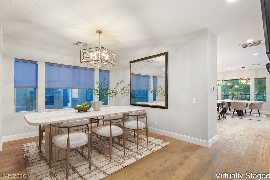 2575 Turtle Head Peak Drive, Las Vegas, NV 89135 Warm hardwood floors and abundant natural light create an inviting dining area.
