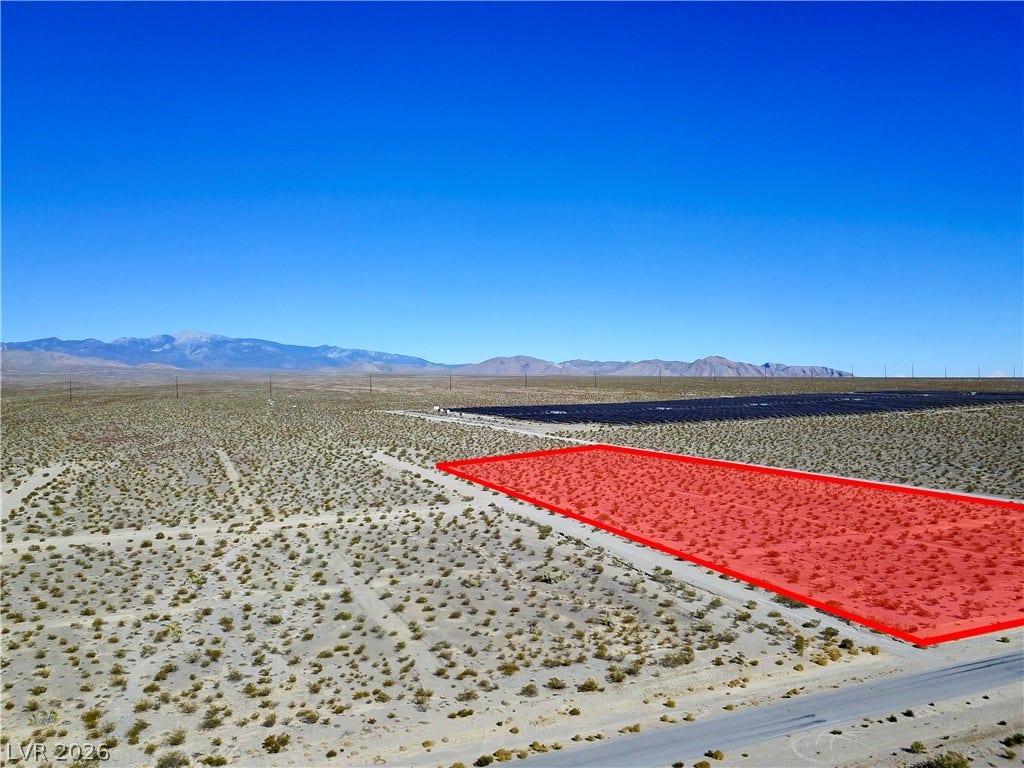 2180 E Simkins Road, Pahrump, NV 89060 Distant mountain ranges border this desert acreage under clear blue skies.