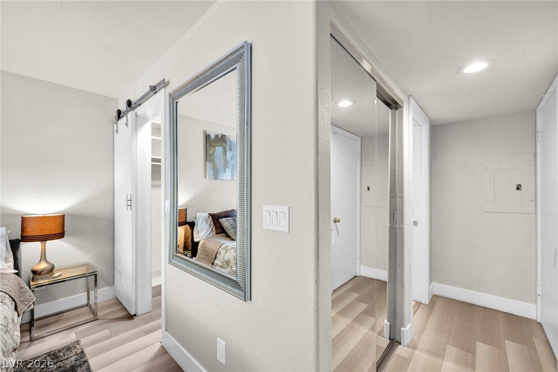 Private hallway connecting the primary bedroom and en suite.
