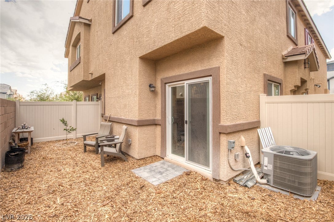 7910 Aurora Sky Street, North Las Vegas, NV 89084 Sliding glass doors open directly to a private, low-maintenance back courtyard area.