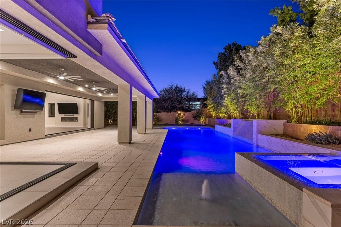 11453 Rhodolite Court, Las Vegas, NV 89135 A spacious covered patio leads directly to a sparkling swimming pool and integrated spa.