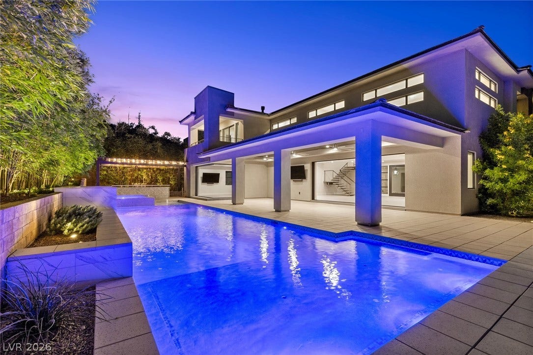 11453 Rhodolite Court, Las Vegas, NV 89135 A sparkling swimming pool anchors the sprawling backyard terrace of this modern two-story estate.