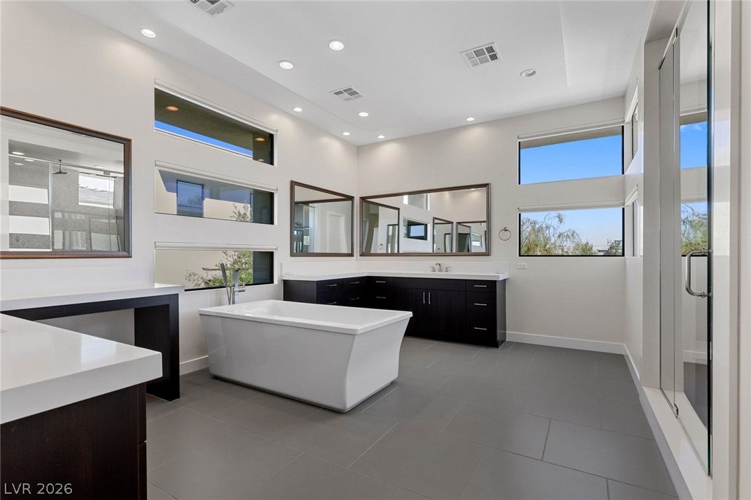 11453 Rhodolite Court, Las Vegas, NV 89135 High ceilings and clean architectural lines define this masterfully designed modern bath.