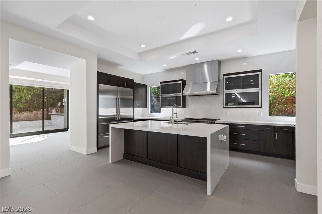 11453 Rhodolite Court, Las Vegas, NV 89135 Sleek contemporary surfaces and clean architectural lines define this gourmet culinary workspace.