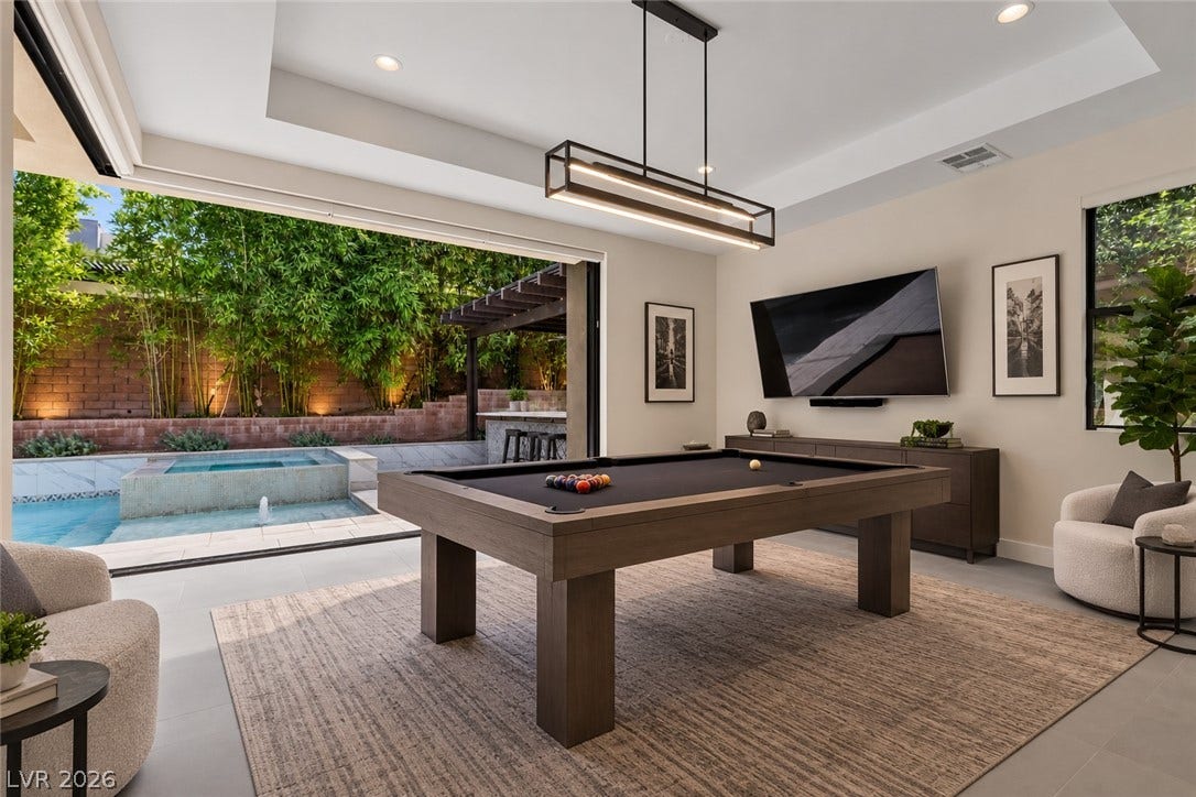 11453 Rhodolite Court, Las Vegas, NV 89135 Retractable glass doors integrate this recreation space with the pool area.