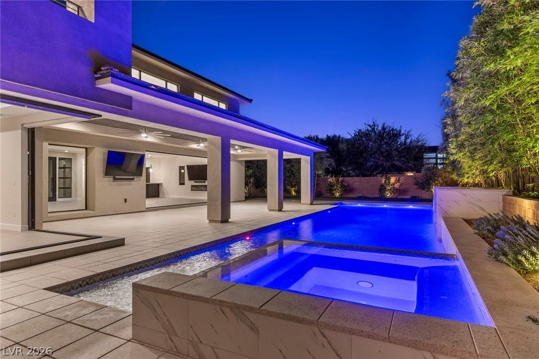 11453 Rhodolite Court, Las Vegas, NV 89135 An inviting swimming pool and integrated spa sit adjacent to the spacious covered patio.