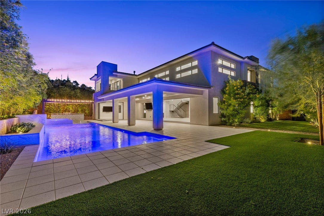 11453 Rhodolite Court, Las Vegas, NV 89135 A sparkling swimming pool anchors the sprawling backyard of this modern multi-level estate.
