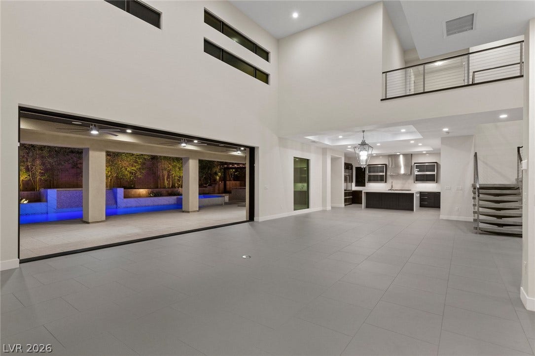 11453 Rhodolite Court, Las Vegas, NV 89135 Soaring ceilings and massive sliding glass doors create seamless indoor-outdoor living.