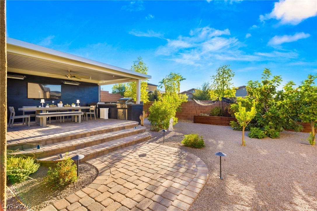 327 Castle Wynd Avenue, Las Vegas, NV 89183 Spacious side yard with lawn, fruit trees and raised garden beds,