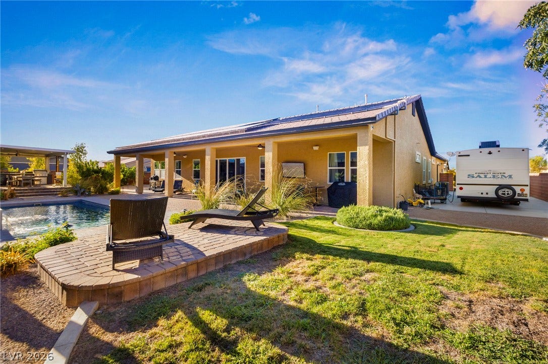 327 Castle Wynd Avenue, Las Vegas, NV 89183 RV parking area 20x55. Paved driveway and gated.