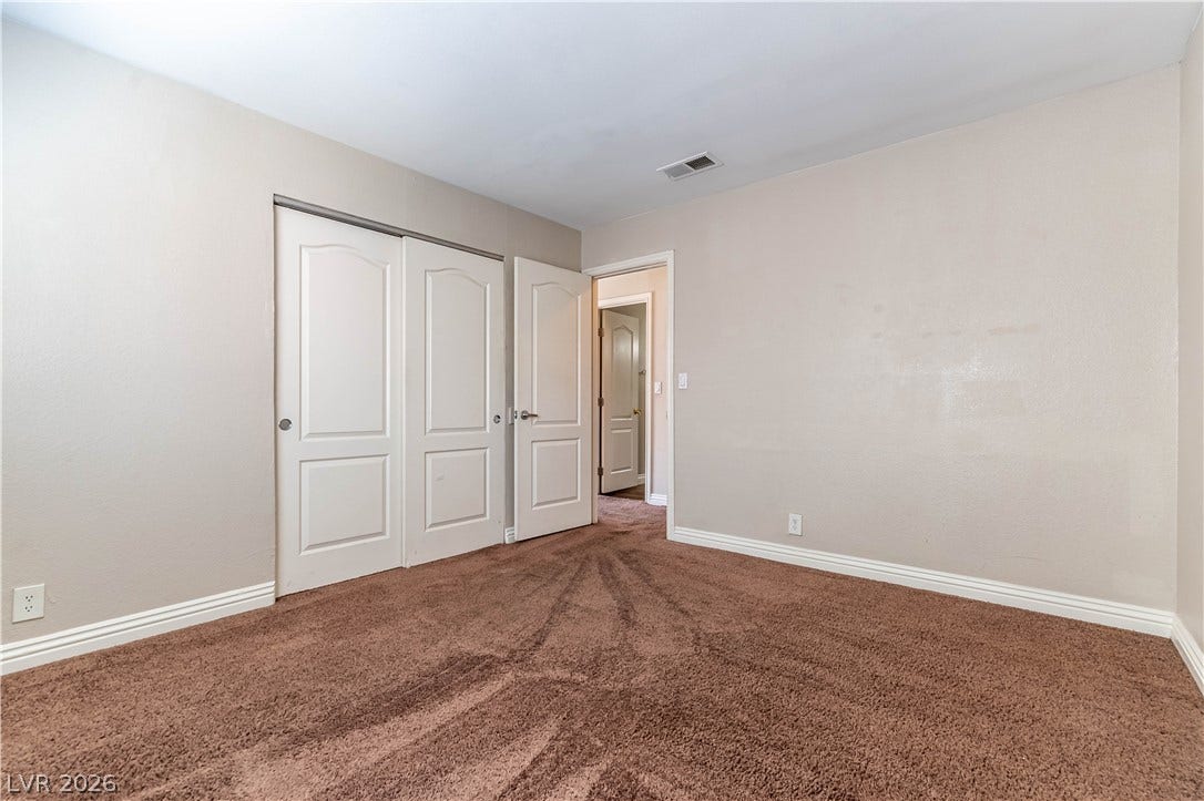 4050 Pacific Harbors Drive, #203, Las Vegas, NV 89121 Plush wall-to-wall carpeting and neutral tones define this versatile secondary bedroom space.